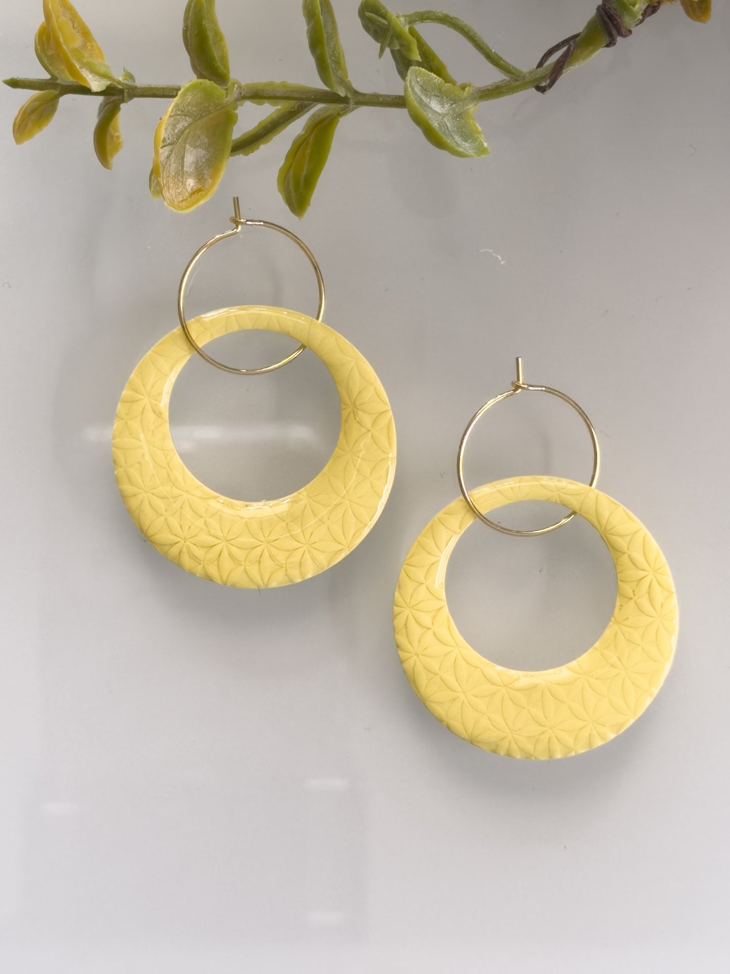 Butter Bloom Hoops yellow polymer clay textured earrings with gold hoops
buttercream yellow lightweight statement earrings handmade polymer clay
pastel yellow textured hoop earrings modern minimalist style
handmade yellow clay earrings with subtle floral texture and gold hoops