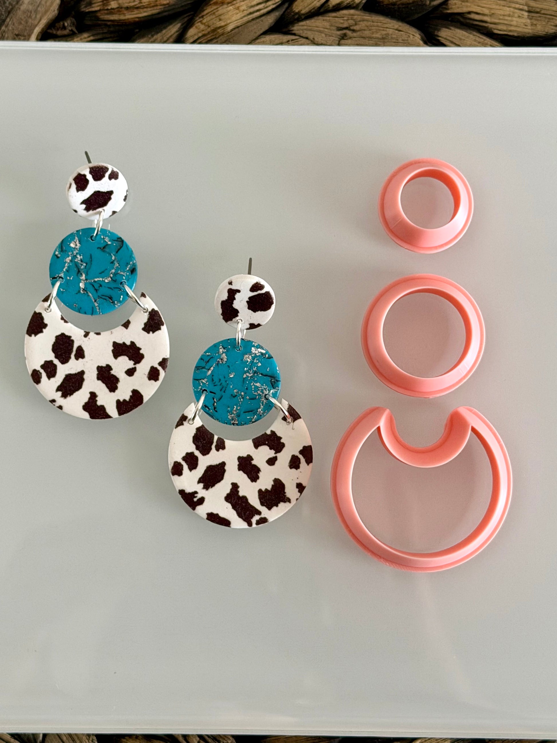 Three-piece modern layered circle polymer clay cutter set for creating geometric statement earrings.