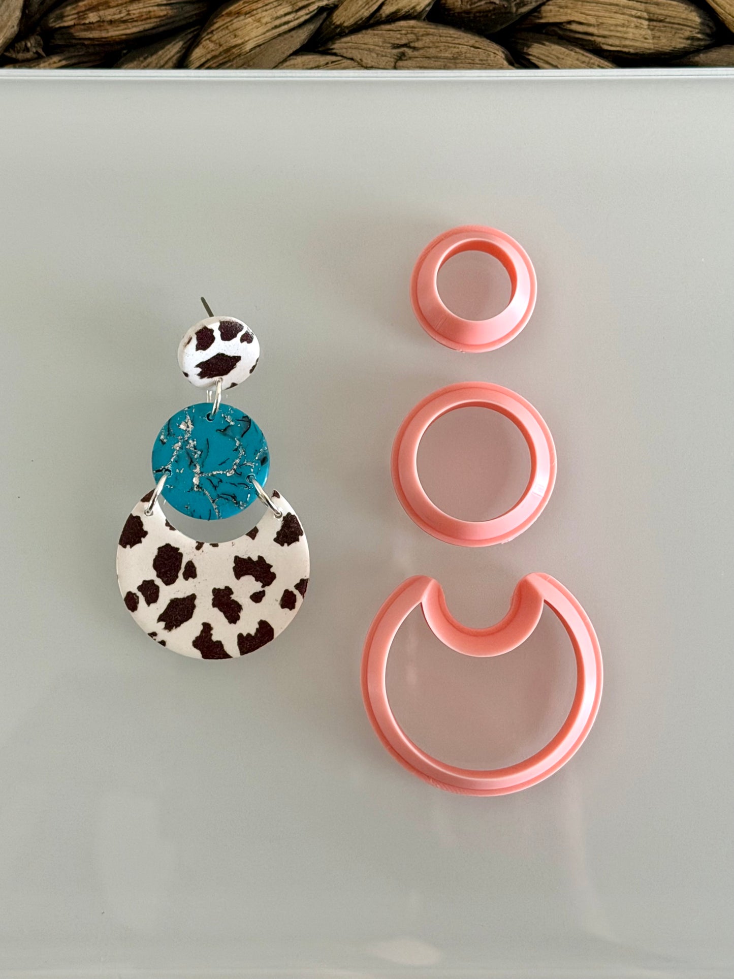 Three-piece modern layered circle polymer clay cutter set for creating geometric statement earrings.