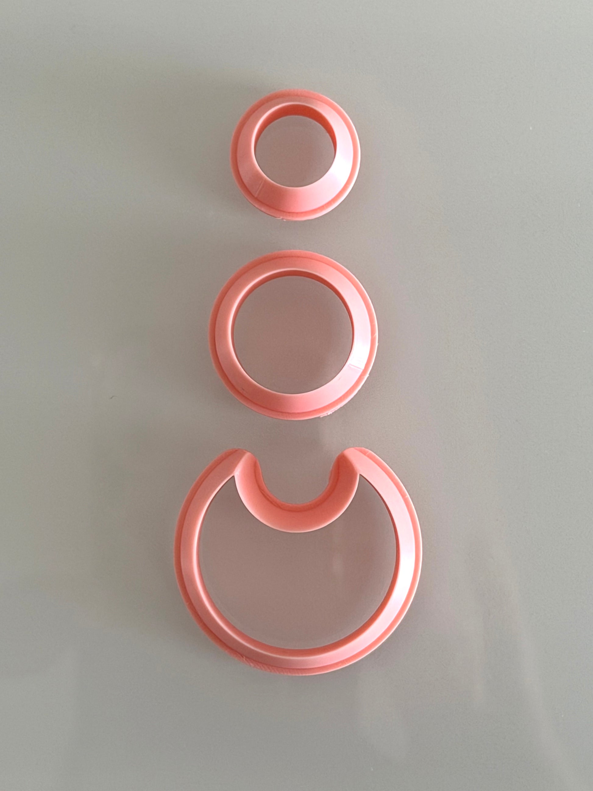 Three-piece modern layered circle polymer clay cutter set for creating geometric statement earrings.