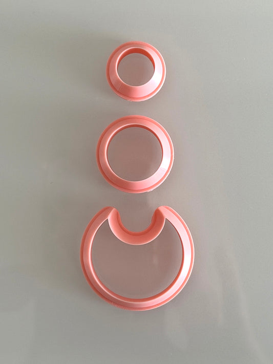 Three-piece modern layered circle polymer clay cutter set for creating geometric statement earrings.